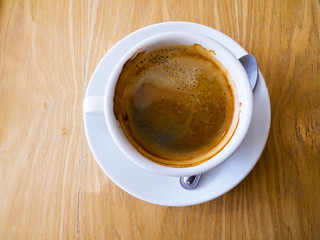 White Coffee Cup in brown background