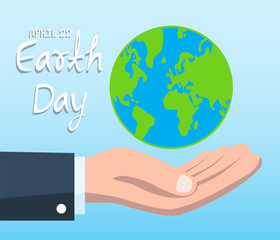 Earth Day concept with hand holding blue globe