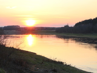 spring river in the evening at sunset
