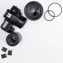 photography concept - photo equipment and copy space over white table