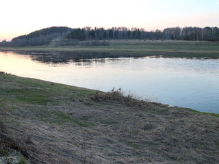 spring river in the evening at sunset