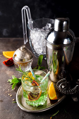 tropical green cocktail with lemon and fresh rosemary