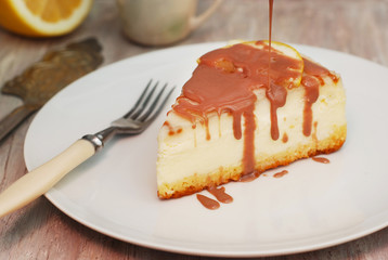 Cheese Cake with Caramel Sauce Isolated Caramel Sauce over Brown Paper with Spoon Sweet Sugar Dessert