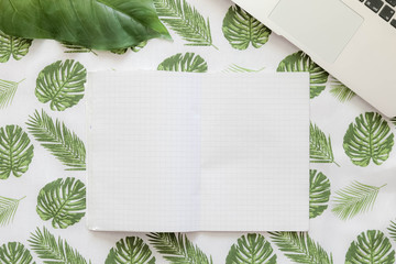 Palm leafs background concept, table, copy space, top view