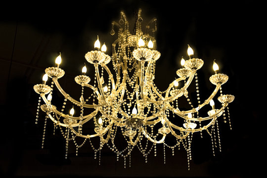  Crystal lamp.Glass chandelier isolated over black background.Closed up