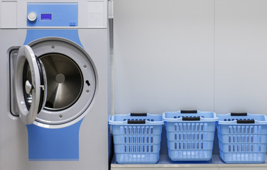 Washing machine and laundry baskets in the self service laundry