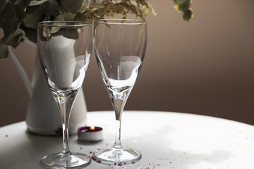 wine glass and candle on the white background . wedding concept.