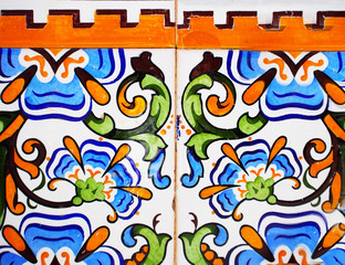 Detail of the traditional tiles from facade of old house. Decorative tiles.Valencian traditional tiles. Floral ornament
