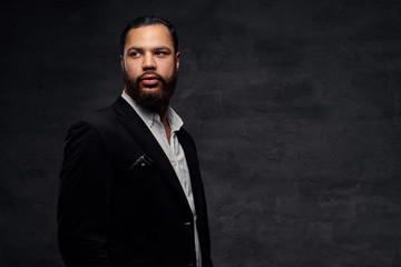 Confident African-American businessman in a black classic jacket.