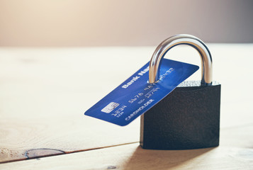 Lock with credit card. Safe shopping and protected paying concept