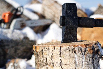 the wood-burning stove stuck in a wooden block, there is a lot of wood in winter time