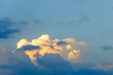 The sky is in the rays of the setting sun.