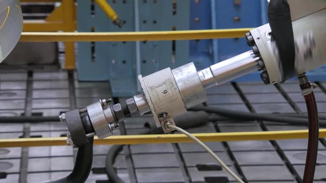 close-up of piston of robotic machine is immitating a car trailer in movement ,bench tests