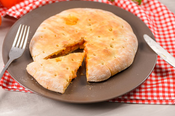 Pizza calzone on wooden background