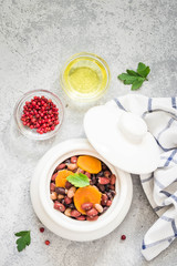 Instant pot sausage beans on concrete background. Top view, space for text. 