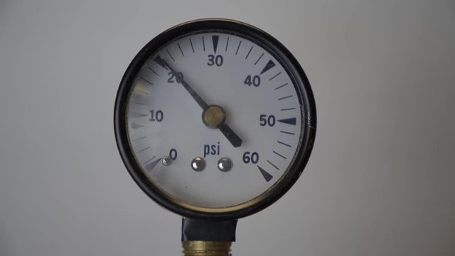 A pressure gauge showing building pressure