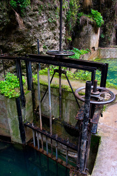 irrigation sluice system with rusty shutoff wheel in ronda, andalusia, spain