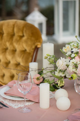 Beautiful wedding table that decorated with flower arrangements and candles.