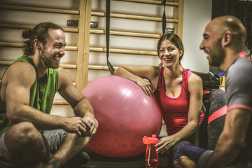 Group of people exercise together.  Break time.