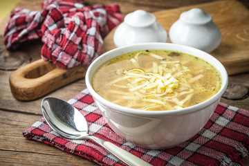 Broth - chicken soup in a bowl.