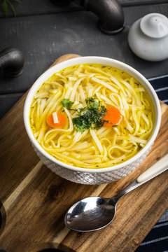 Tasty meat broth with noodles.