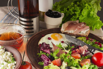 fresh salad with tomato, egg and toast