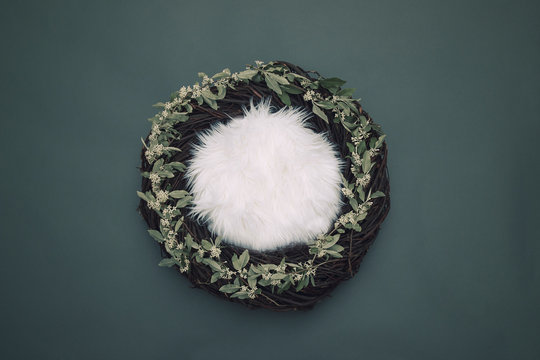 cozy fantasy nest with soft bedding and decorative white flowers on gray background