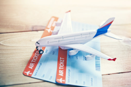 Plane model with tickets as airplane traveling and tickets booking concept