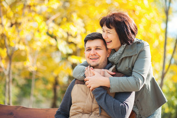 Loving happy mature mother hugging adult son in beautiful sunny park. Mother Day Lifestyle People...