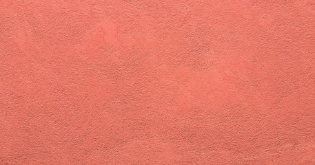 Grungy painted wall texture as background. Cracked concrete vintage floor, old red painted....