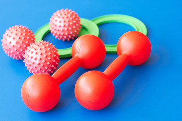  Dumbbells, balls and gymnastic rings.