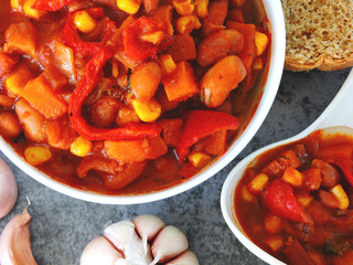 Beans with garlic in Mexican style in a white bowl