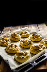 Dough dainted by the woman on the board