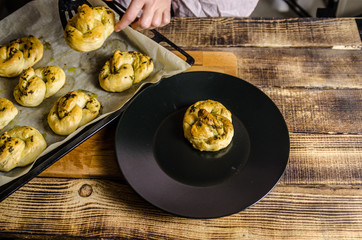 Dough dainted by the woman on the board