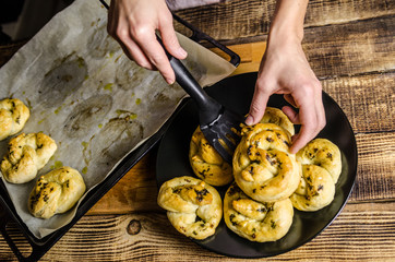 Dough dainted by the woman on the board