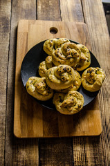Dough dainted by the woman on the board