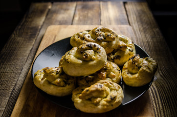 Dough dainted by the woman on the board