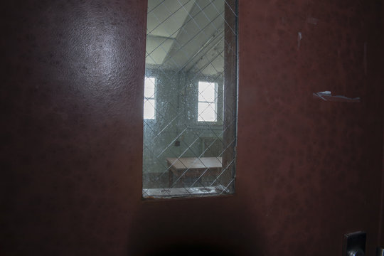 Table behind mesh windows in prison