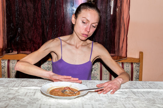 Young skinny anorexic girl with anorexia refusing to eat. Anorexia girl problem