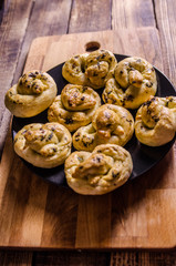 Dough dainted by the woman on the board