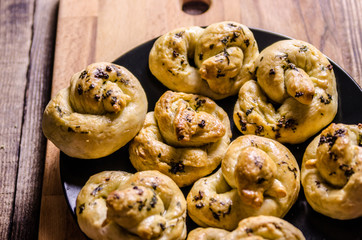 Dough dainted by the woman on the board