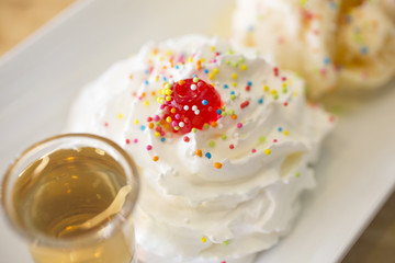 Close-Up of Dessert Jelly on whipped cream.