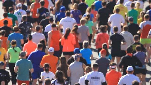 City marathon of people running in blurred