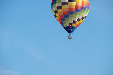 Hot-air balloon in flight nears the ground, It stated to lose altitude as there was a instructing pilot  on board learning soft landings.  