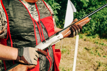 shooter uniform equipment holds hunting rifle