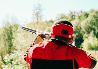 hunter is aiming shot shotgun forest
