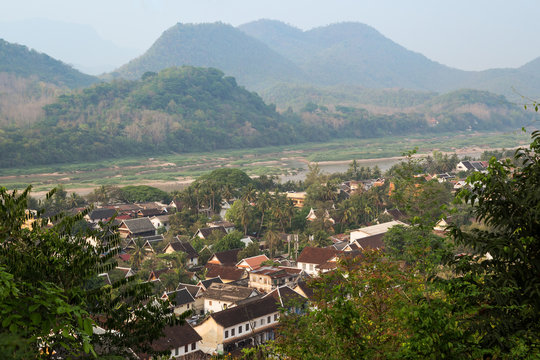The city of Luang Prabang, Mekong River and beyond viewed from above from the Mount Phousi (Phou Si, Phusi, Phu Si) in Laos on a sunny day.
