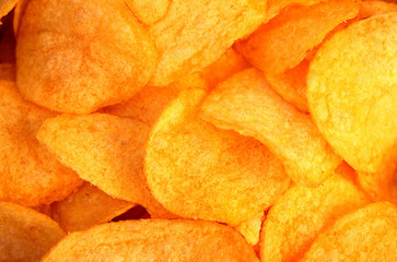 glass plate with crispy delicious potato chips