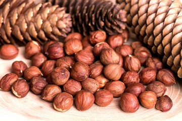 Hazelnut, forest bumps on a wooden background