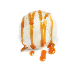 Tasty ice cream ball with caramel sauce on white background